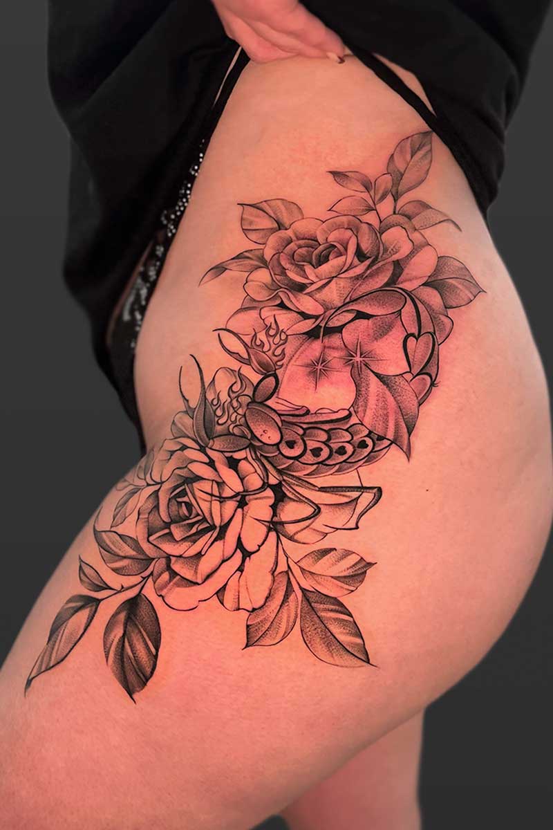 Legacy Tattoo| Black and grey tattoo of a butterfly with abstract veins behind it