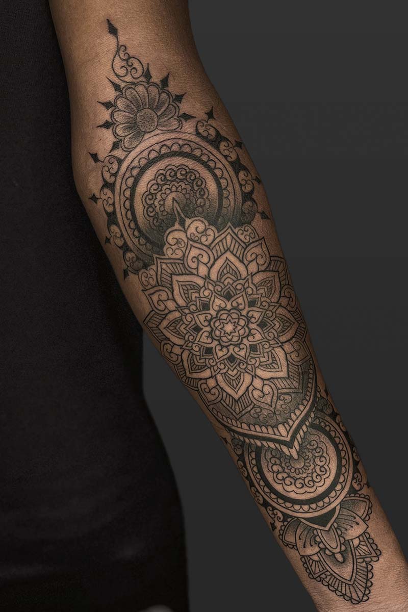 Legacy Tattoo| Black and grey, realism tattoo of an owl's face with abstract elements around it