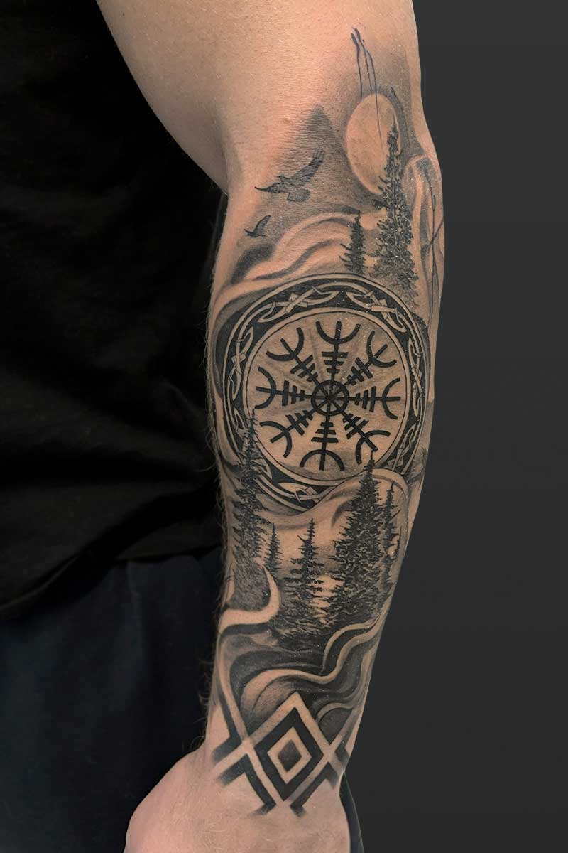 Legacy Tattoo| Black and grey tattoo of a forest with Viking runes