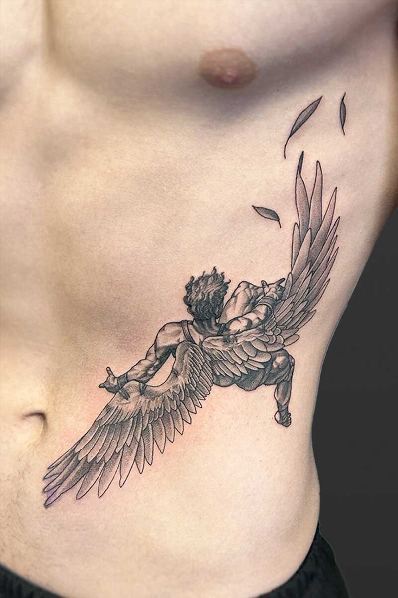 Legacy Tattoo| Black and grey tattoo of Icarus falling
