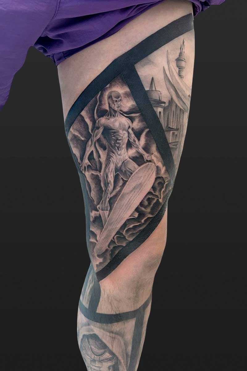 Legacy Tattoo| Black and grey tattoo of the Silver Surfer and scenes from Marvel comics