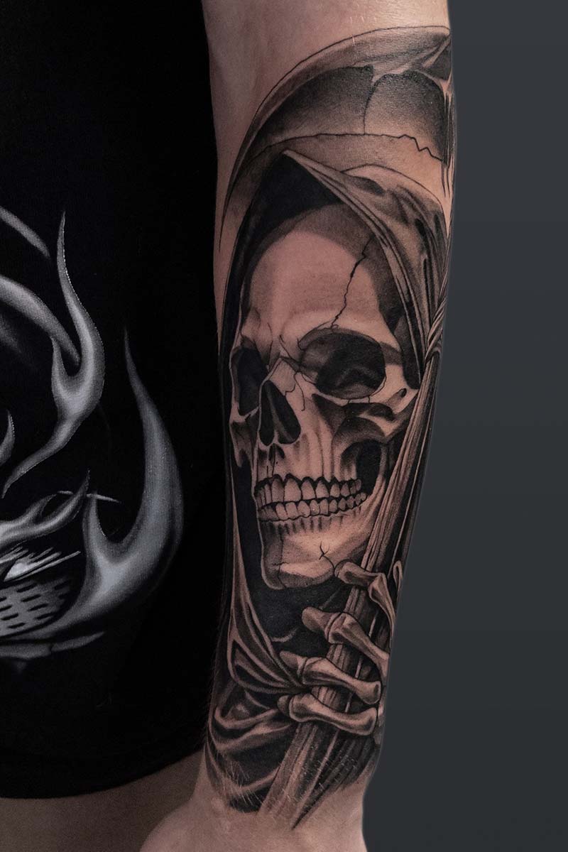 Legacy Tattoo| Black and grey, realism tattoo of Death holding a scythe