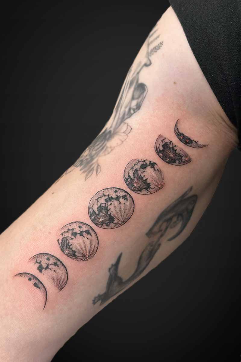 Legacy Tattoo| Black and grey, realism tattoo of the moon phases