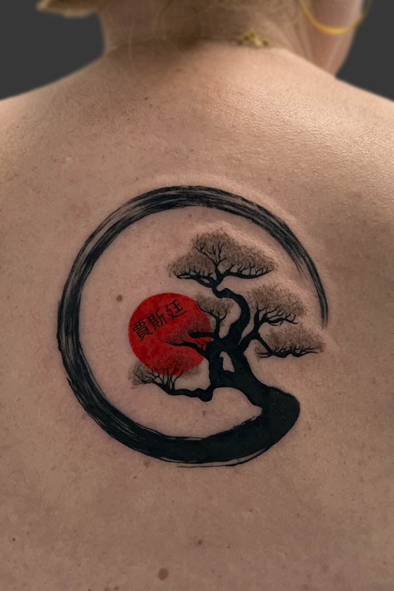 Legacy Tattoo| Chinese ink wash tattoo of a tree with a red sunset and script