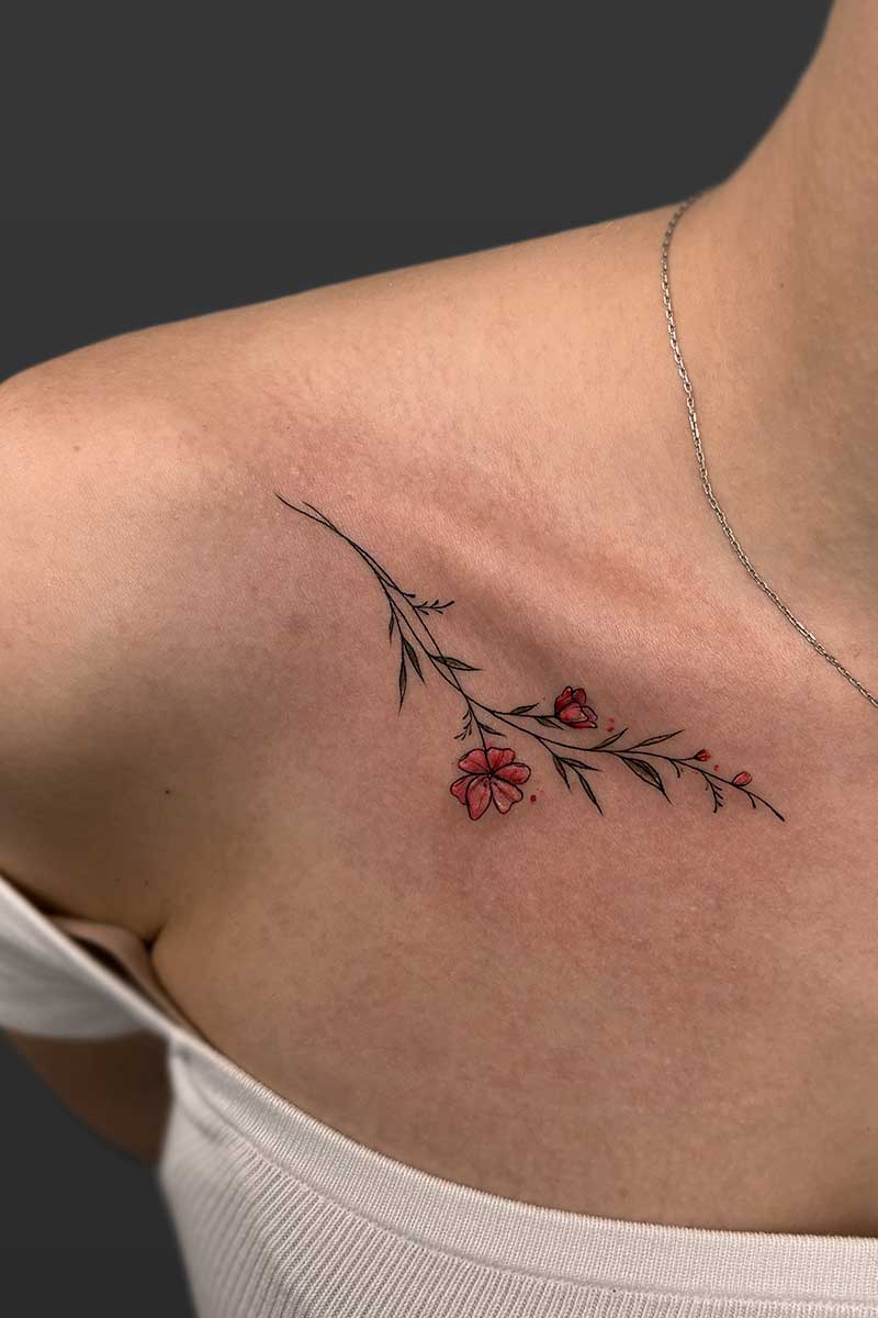 Legacy Tattoo| Walk-in Tattoo| Fineline, colour tattoo of a stem of red flowers