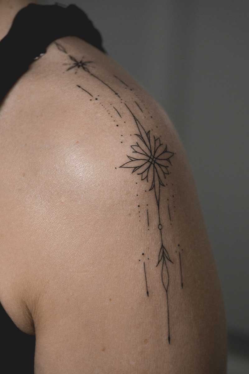 Legacy Tattoo| Fineline tattoo of ornamental stars, lines and dots