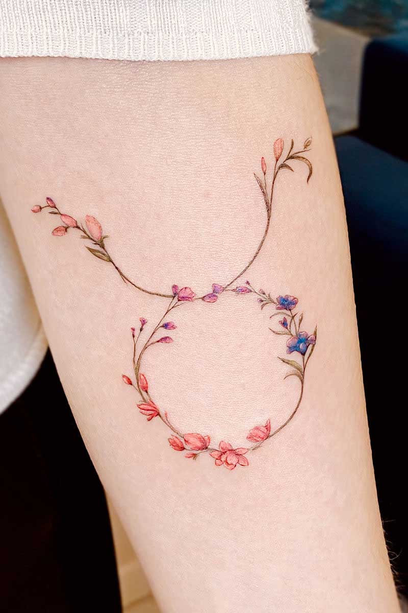 Legacy Tattoo| Fineline tattoo of the Taurus sign made of small flowers