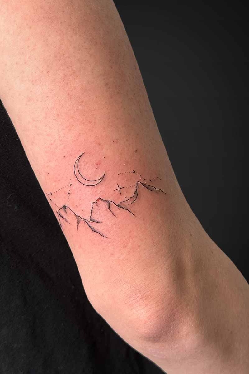 Legacy Tattoo| Fineline tattoo of the three sisters mountains, crescent moon and stars