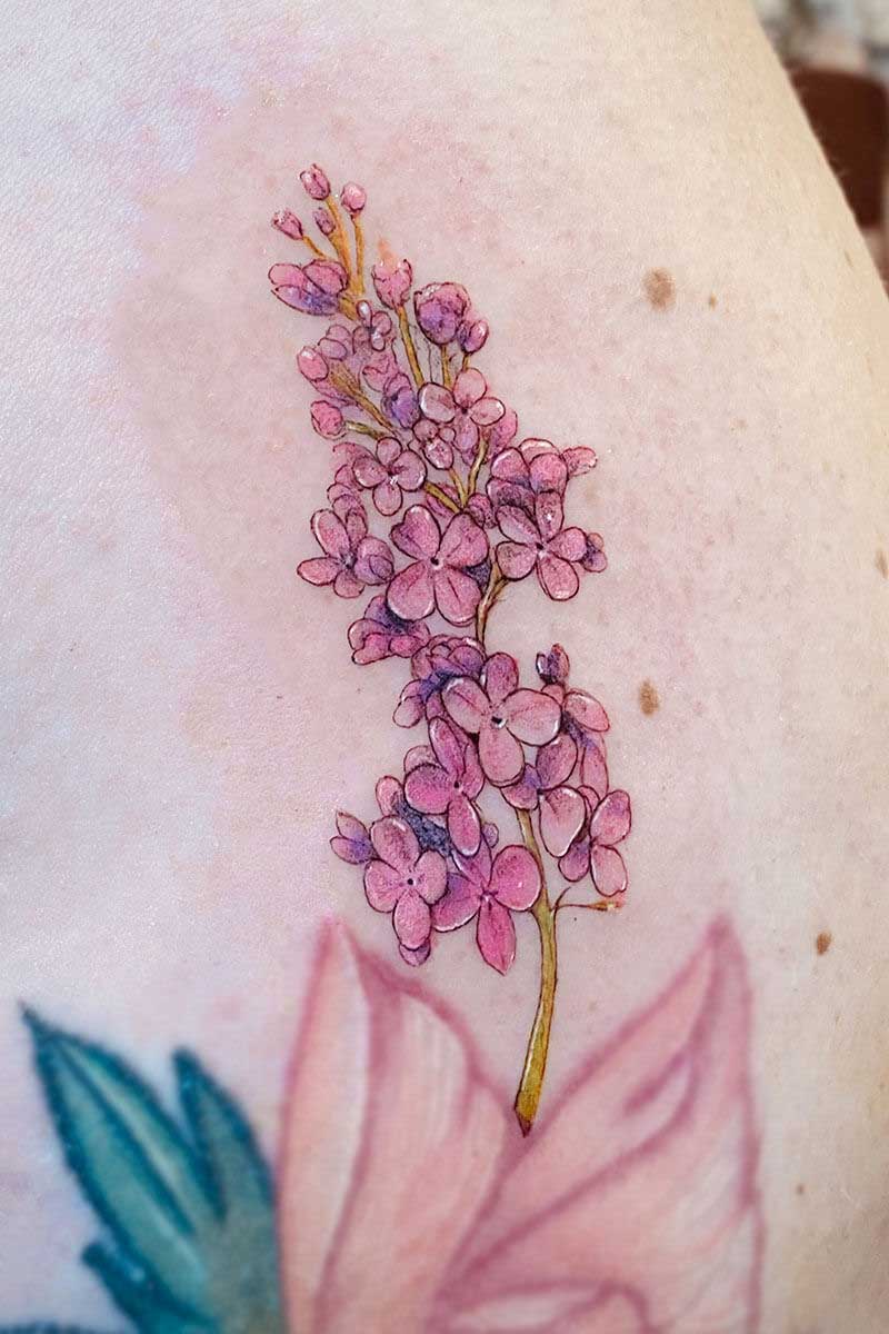 Legacy Tattoo| Fineline tattoo of purple lilacs