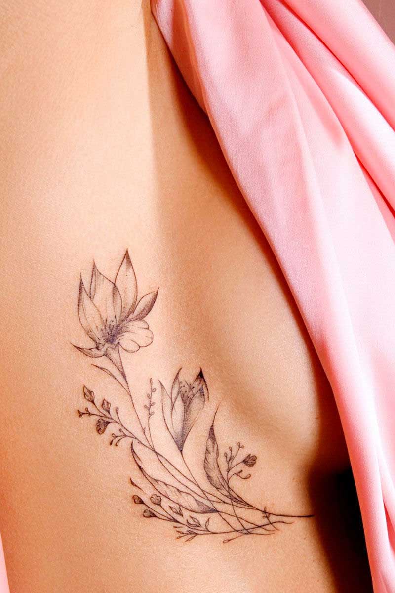 Legacy Tattoo| Walk-in Tattoo| Fineline tattoo of stems of flowers