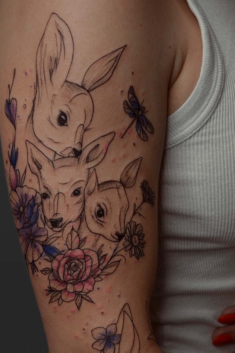Legacy Tattoo| Fineline tattoo of a family of deer and watercolour flowers