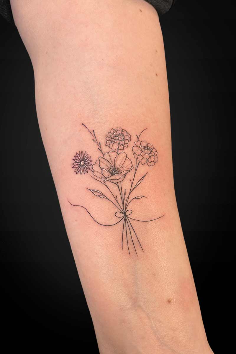 Legacy Tattoo| Fineline tattoo of a bouquet of flowers