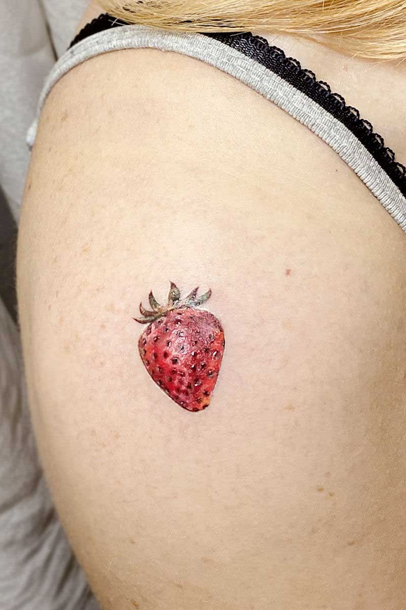 Legacy Tattoo| Microrealism tattoo of a red strawberry