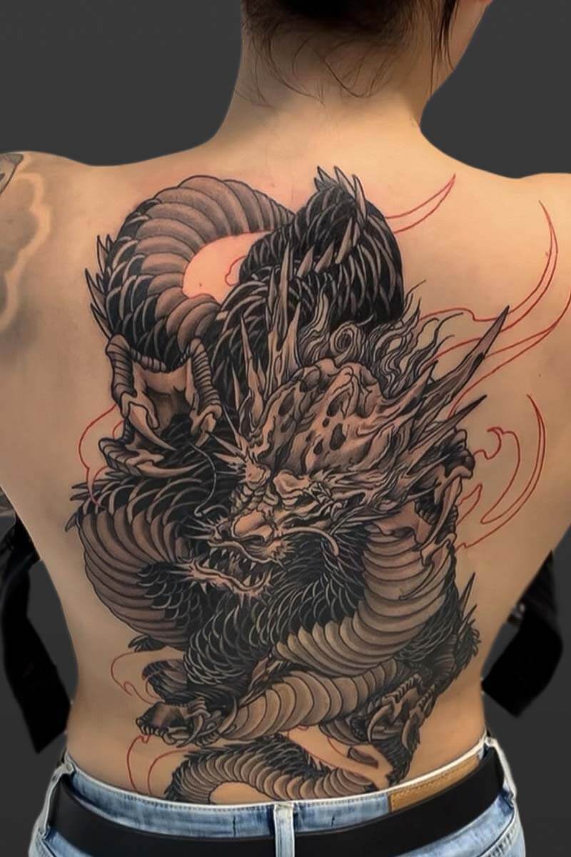 Legacy Tattoo| Black and grey, neotraditional tattoo of a large, twisted Japanese dragon on the client's back