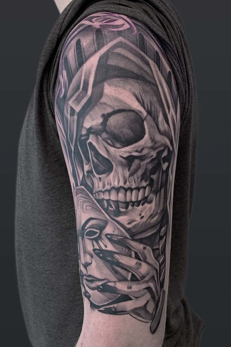 Legacy Tattoo| Neotraditional, realism tattoo of a skull and a hand holding a mask