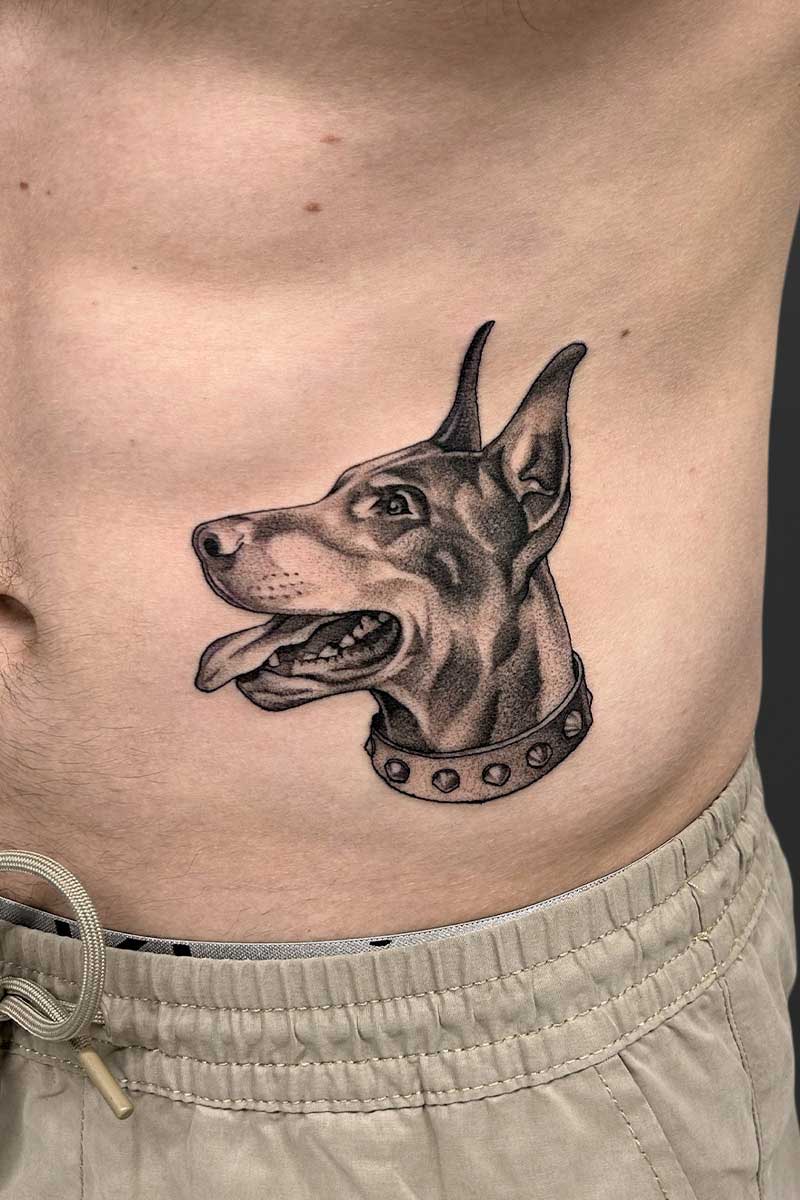 Legacy Tattoo| Realism tattoo of a doberman's portrait