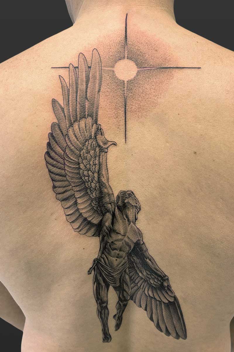 Legacy Tattoo| Black and grey, realism tattoo of Icarus reaching towards the sun