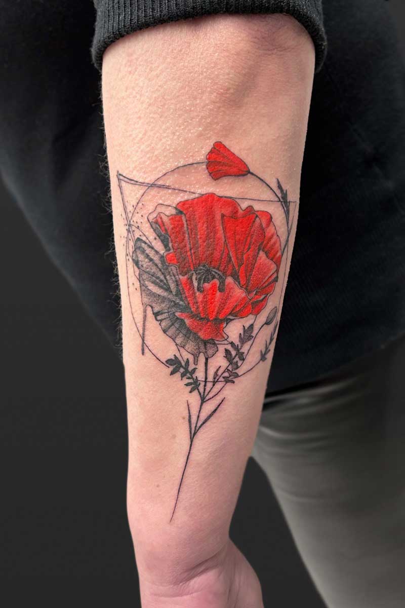 Legacy Tattoo| Abstract tattoo of a grey and red poppy