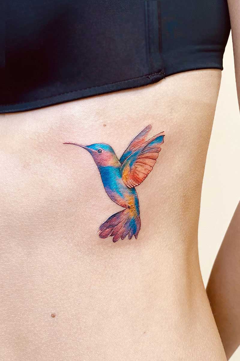 Legacy Tattoo| Watercolour tattoo of a colourful hummingbird