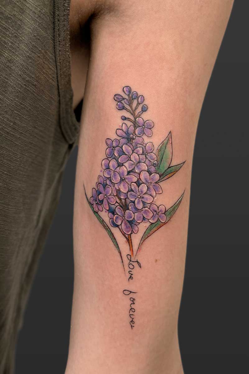 Legacy Tattoo| Watercolour tattoo of purple flowers