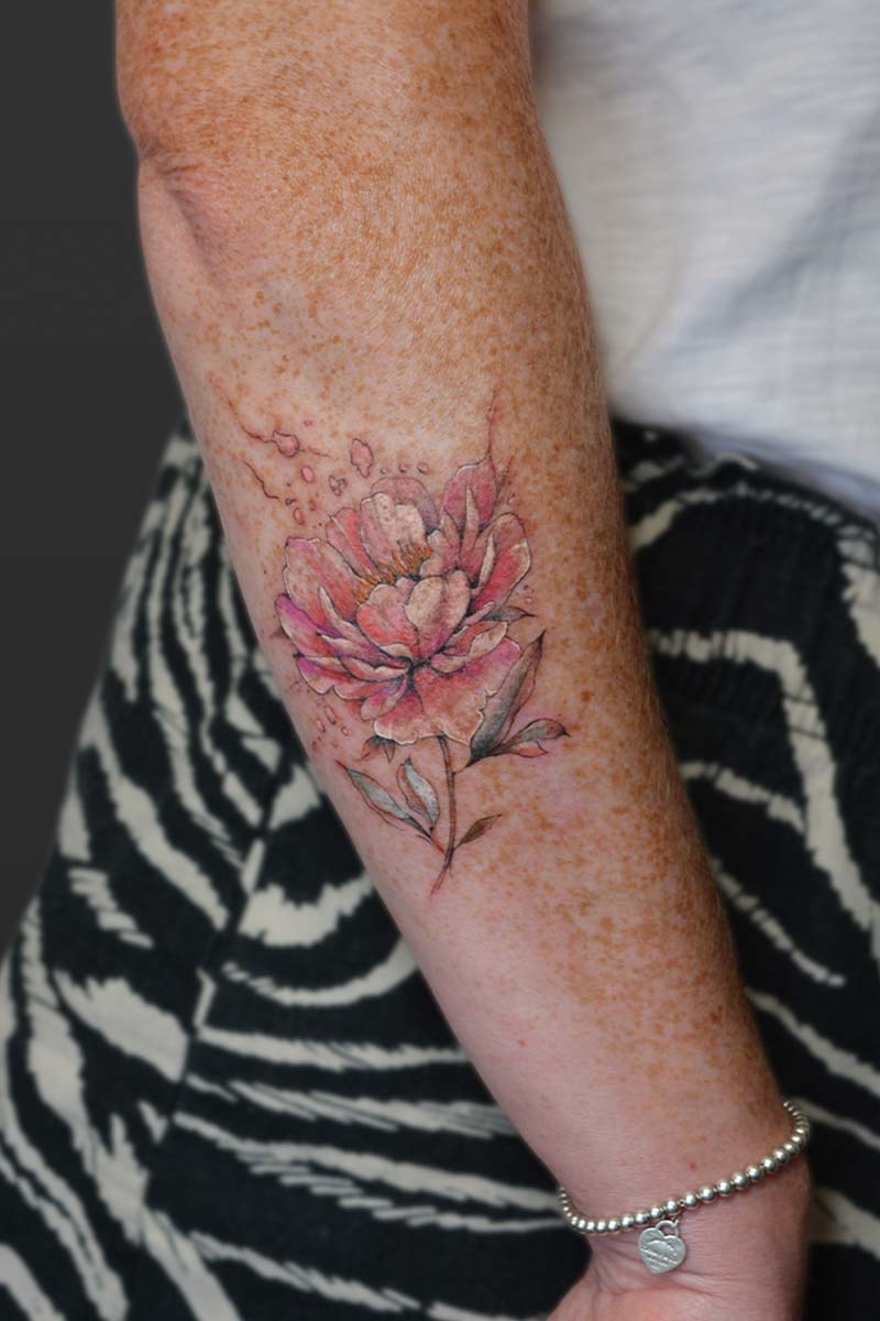 Legacy Tattoo| Fineline, watercolour tattoo of a pink peony