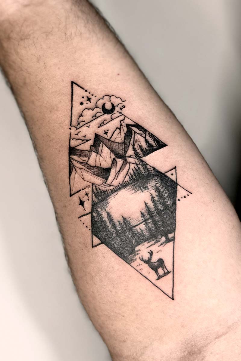 Legacy Tattoo| Black and grey tattoo of a mountain scene with triangles