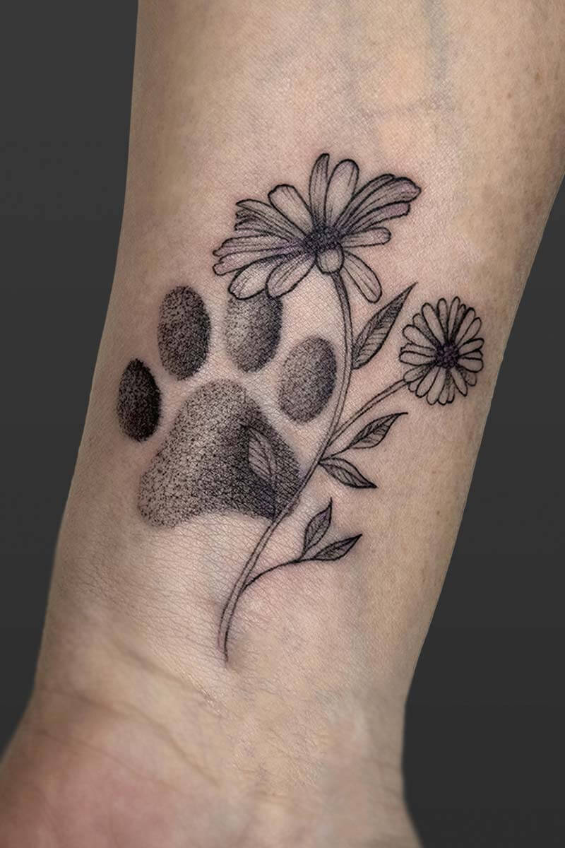 Legacy Tattoo| Black and grey, pet tattoo of a flower and a paw print