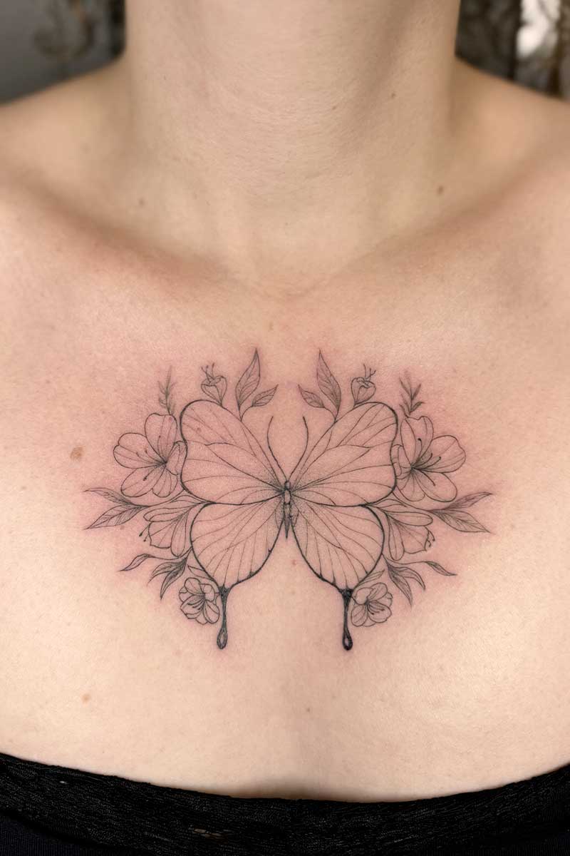 Legacy Tattoo| Walk-in Tattoo| Fineline, floral tattoo of a butterfly with flowers