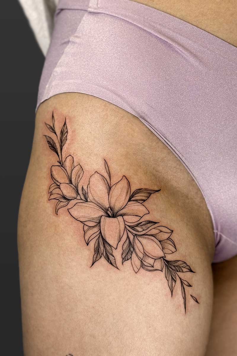 Legacy Tattoo| Fineline, floral tattoo of lilys