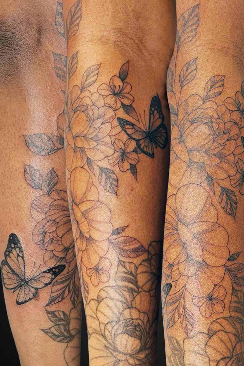 Legacy Tattoo| Fineline, floral tattoo of a floral sleeve and butterflies