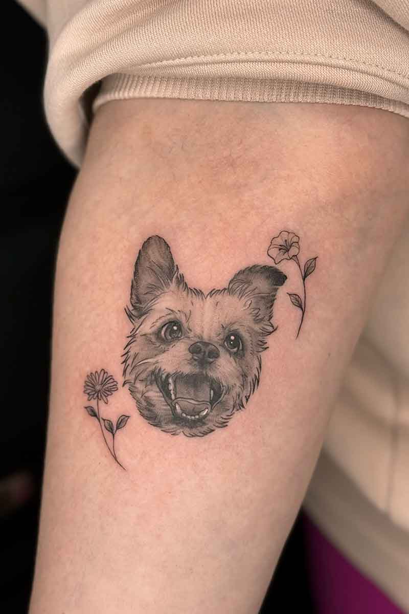 Legacy Tattoo| Black and grey tattoo of a pet dog and flowers