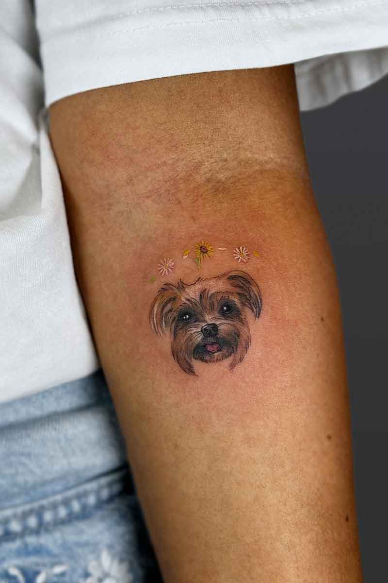 Legacy Tattoo| Realism pet tattoo of a small dog and daisies